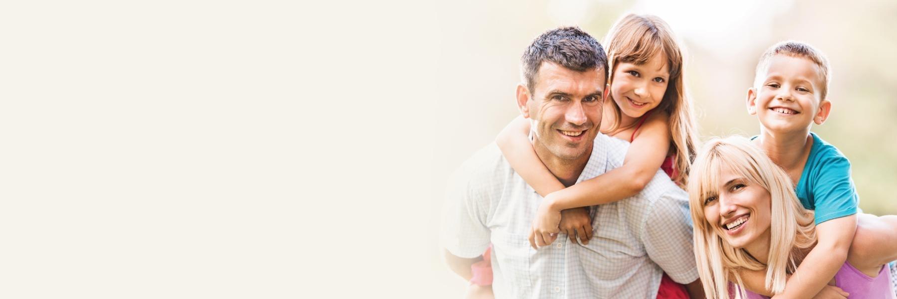 man with daughter hugging & smiling l dentist clinton township