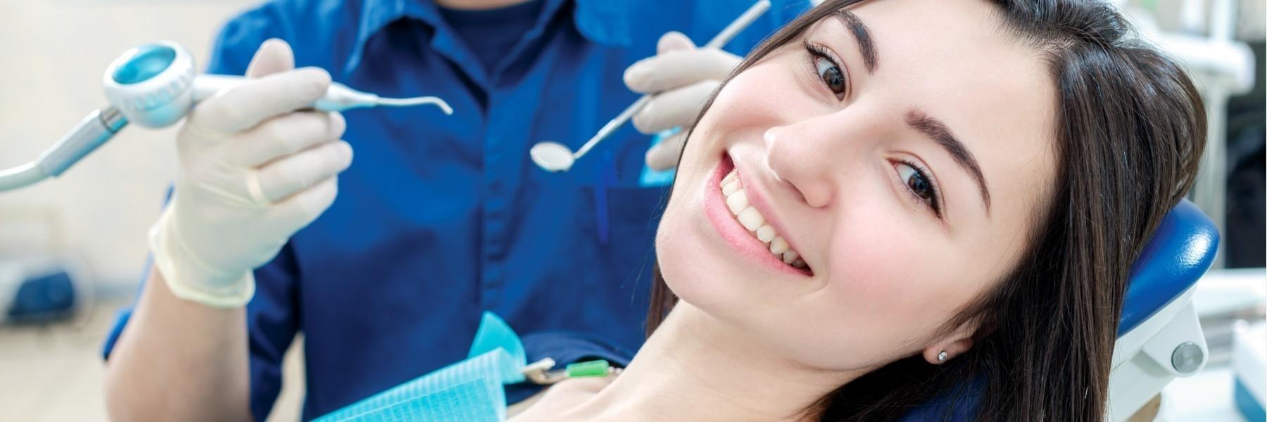 Girl laying in dental exam chair l emergency dentist clinton township